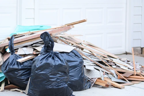 How to Dispose of Treated Wood with a Dumpster Rental